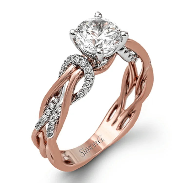 Women’s cushion cut engagement rings-This impressive contemporary two-tone engagement ring features a unique twisting design on the shank, which is complemented by .17 ctw of round cut white diamonds.