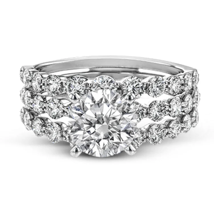 Women’s champagne diamond engagement rings-This 18k white gold engagement set certainly makes a statement with 1.72 ctw of white diamonds set in three rows.