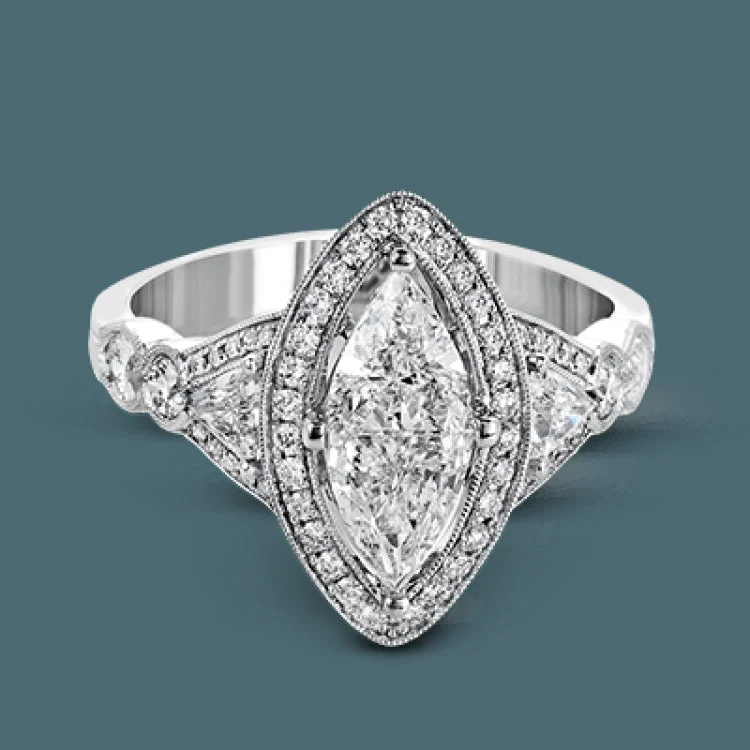 Women’s personalized engagement rings-This gorgeous 18k white gold engagement ring setting features a marquise shaped halo, two trillion-shaped side stones totally .23 ctw and two marquise side diamonds totaling 17 ctw.These are surroundied by .29 ctw of smaller round diamonds.