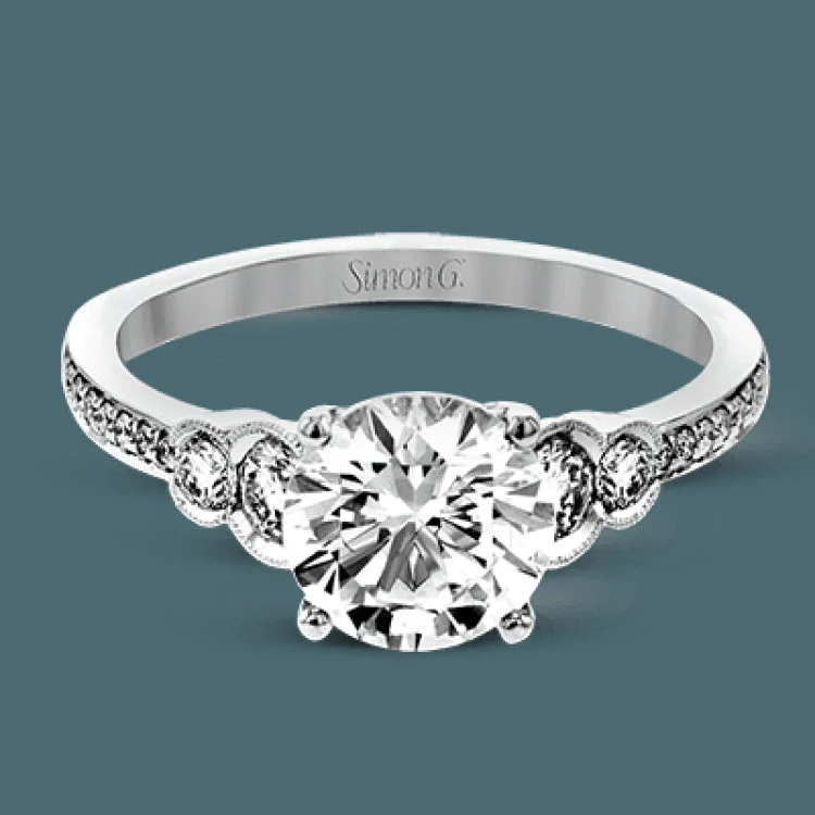 Women’s luxury engagement rings-Timelessly beautiful, this white gold engagement ring's stunning design features .44 ctw of round white diamonds flanking the center stone with a lovely tapered effect.