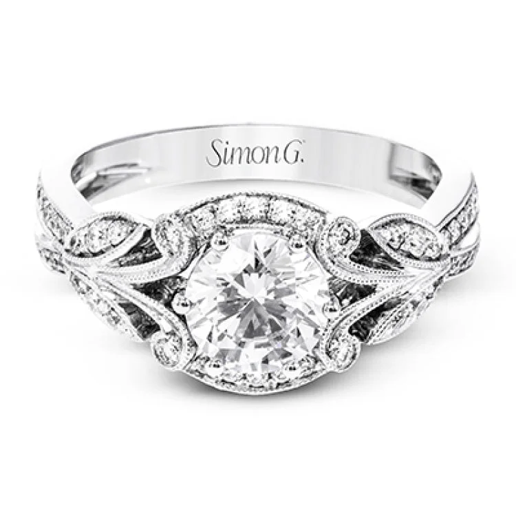 Women’s affordable engagement rings-This amazing 18k white gold engagement ring features vintage-inspired design elements set with .28 ctw of white diamonds.