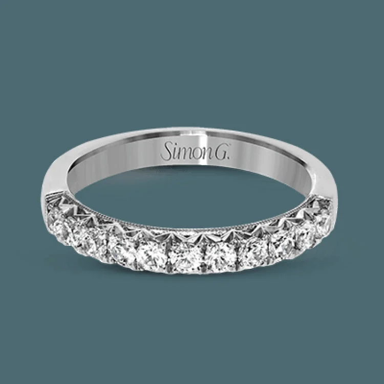 Women’s unique engagement rings-This classic wedding band features a distinctive setting style that shows off the .50 ctw of white diamonds to their full advantage.