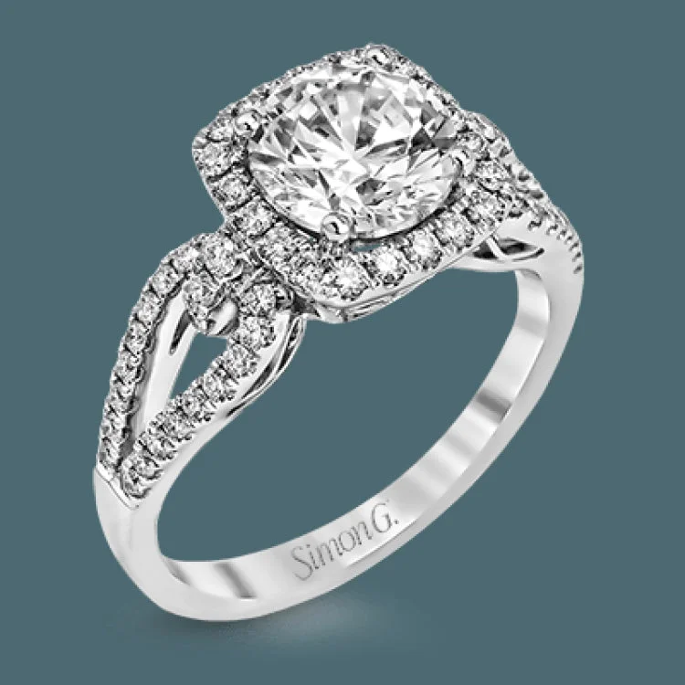 Women’s engagement rings with oval diamonds-The delicate romantic design of this vintage inspired white and rose gold engagement ring and wedding band set is accentuated by .45 ctw of white diamonds and .08 ctw of pink diamonds.