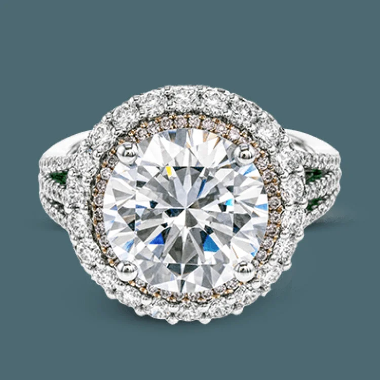 Women’s wedding and engagement rings-This 18k white and rose gold engagement ring is sure to turn heads with 1.09 ctw of white diamonds as well as .12 ctw of pink diamonds.