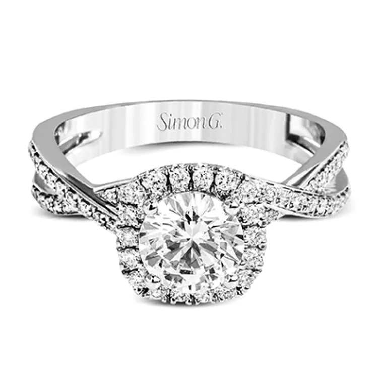 Women’s engagement rings with oval diamonds-This sparkling modern engagement ring features an eye-catching twisted design with elegant classic halo accented by .29 ctw of shimmering round cut white diamonds.