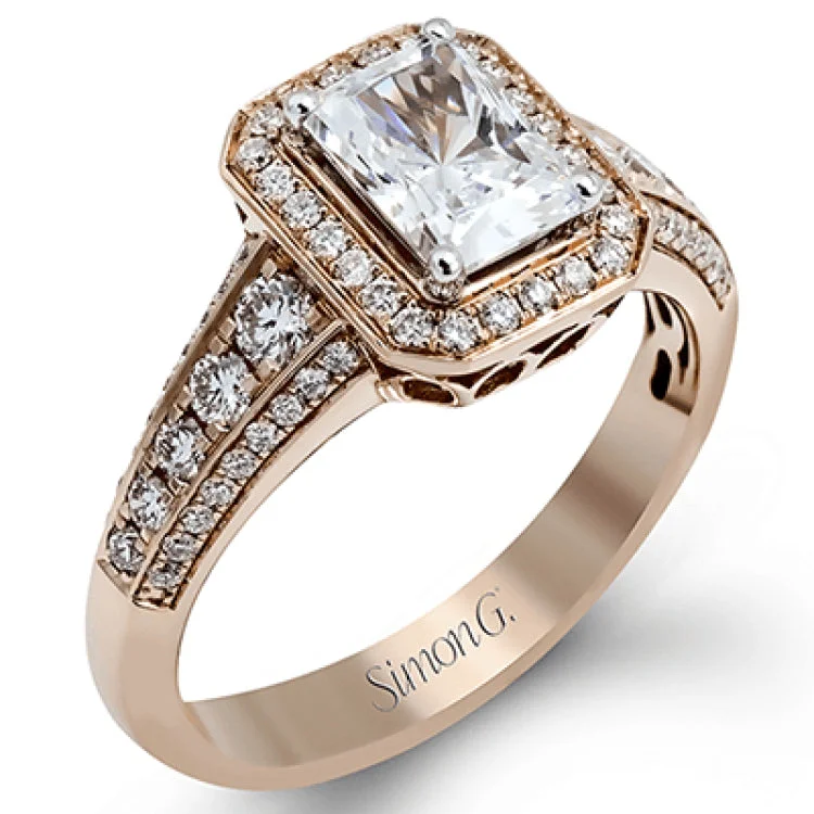 Women’s two-tone engagement rings-This romantic white gold engagement ring is complemented by .57 ctw of sparkling round cut white diamonds in a vintage-inspired setting.